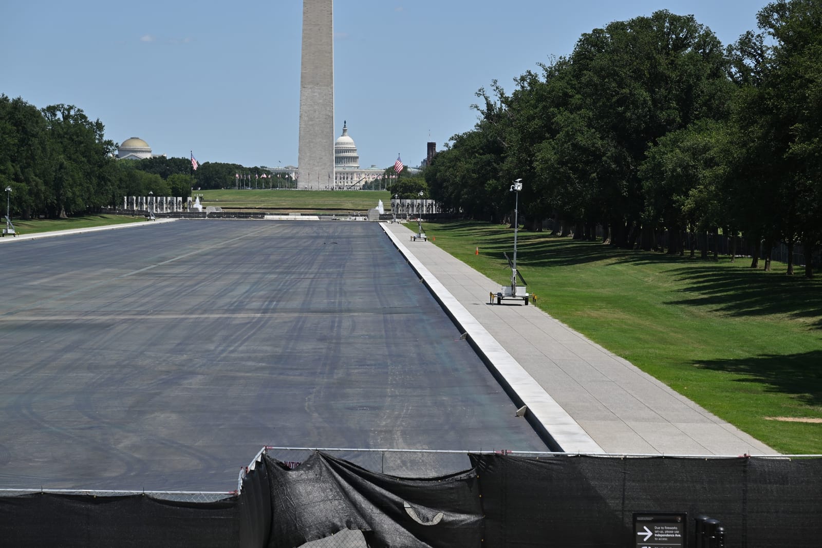 The Lincoln Memorial Reflecting Pool drained and fenced for repairs to its new "American Flag Blue" lining, July 23, 2026