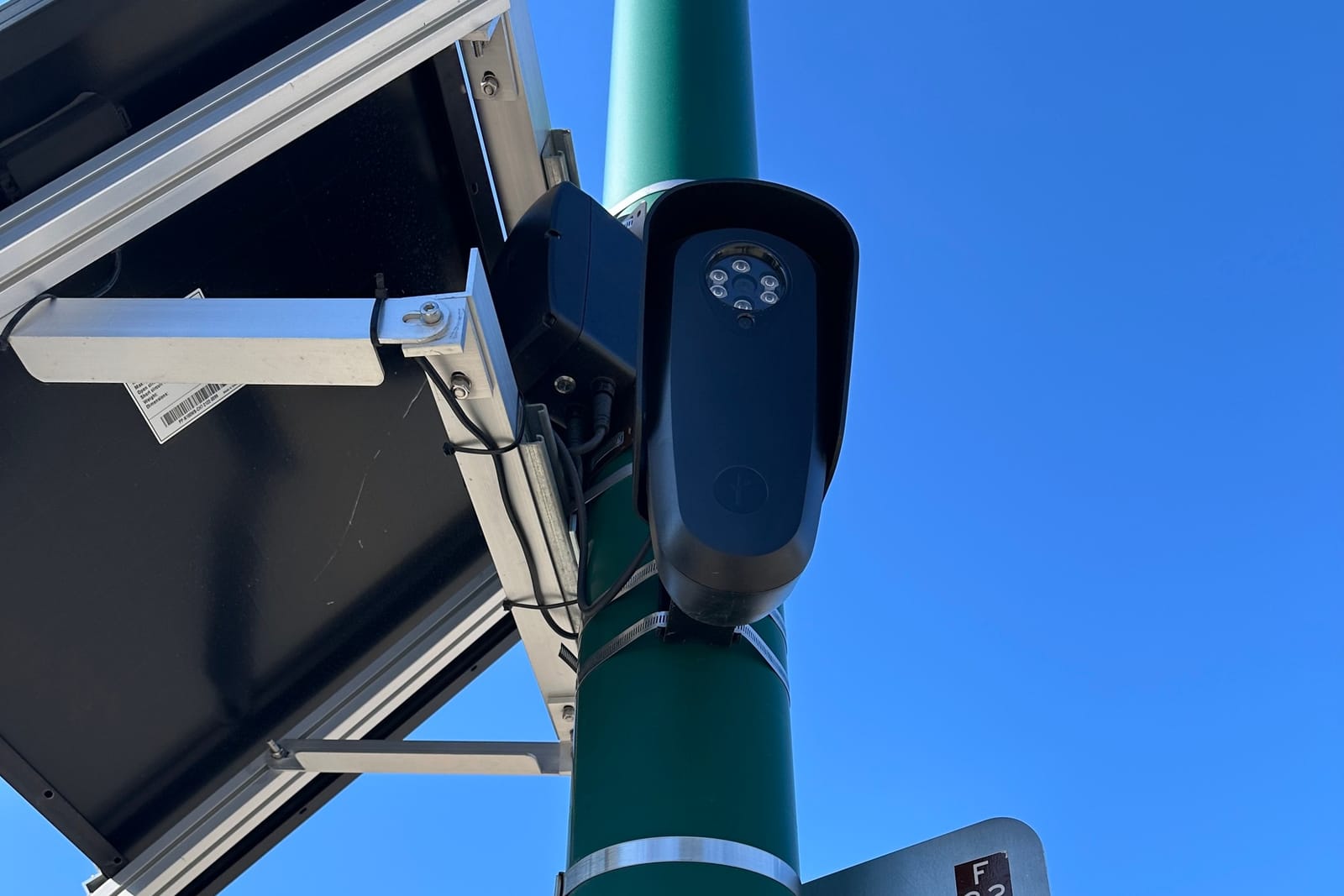 Close-up of a Flock Safety license plate reader camera.