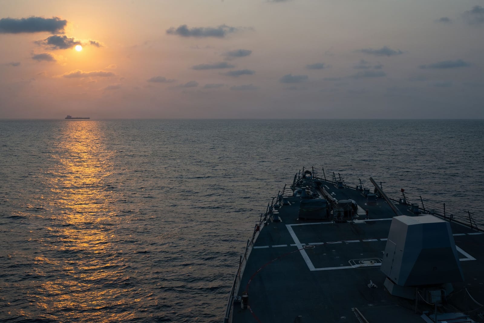 Arleigh Burke-class destroyer USS Pinckney (DDG 91) escorting a vessel while conducting blockade operations, April 22, 2026.
