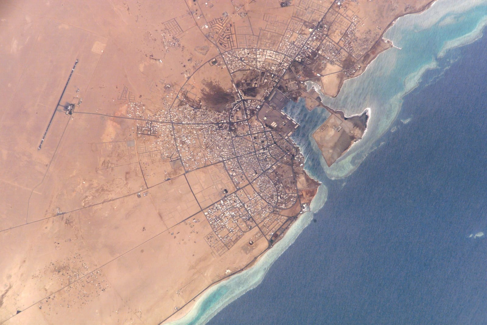 Astronaut photograph from the International Space Station of Yanbu' al Bahr on Saudi Arabia's Red Sea coast, the terminus of the East-West pipeline.