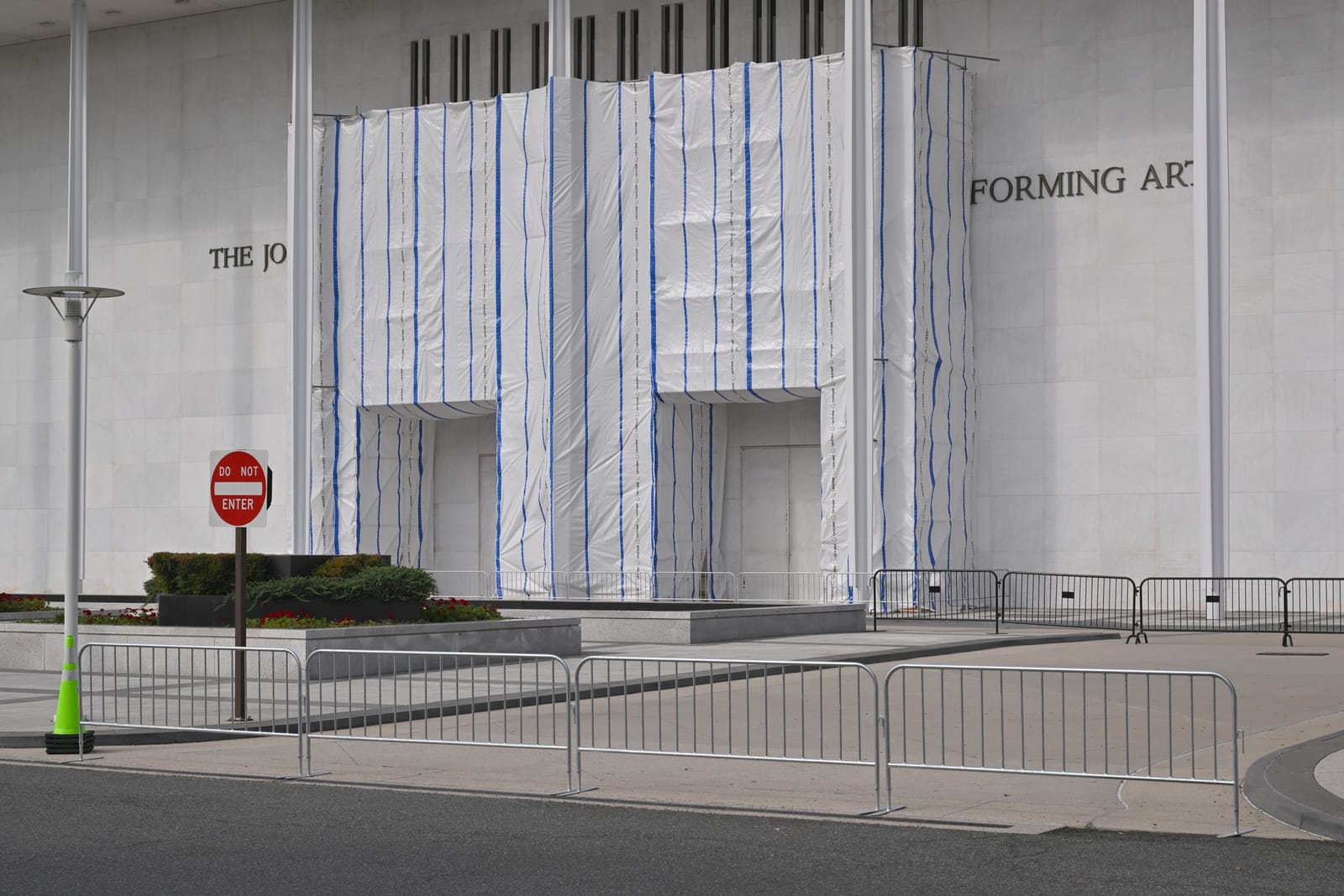 Silver temporary safety barrier blocking a drop-off loop at the closed Kennedy Center, Sept 21, 2026