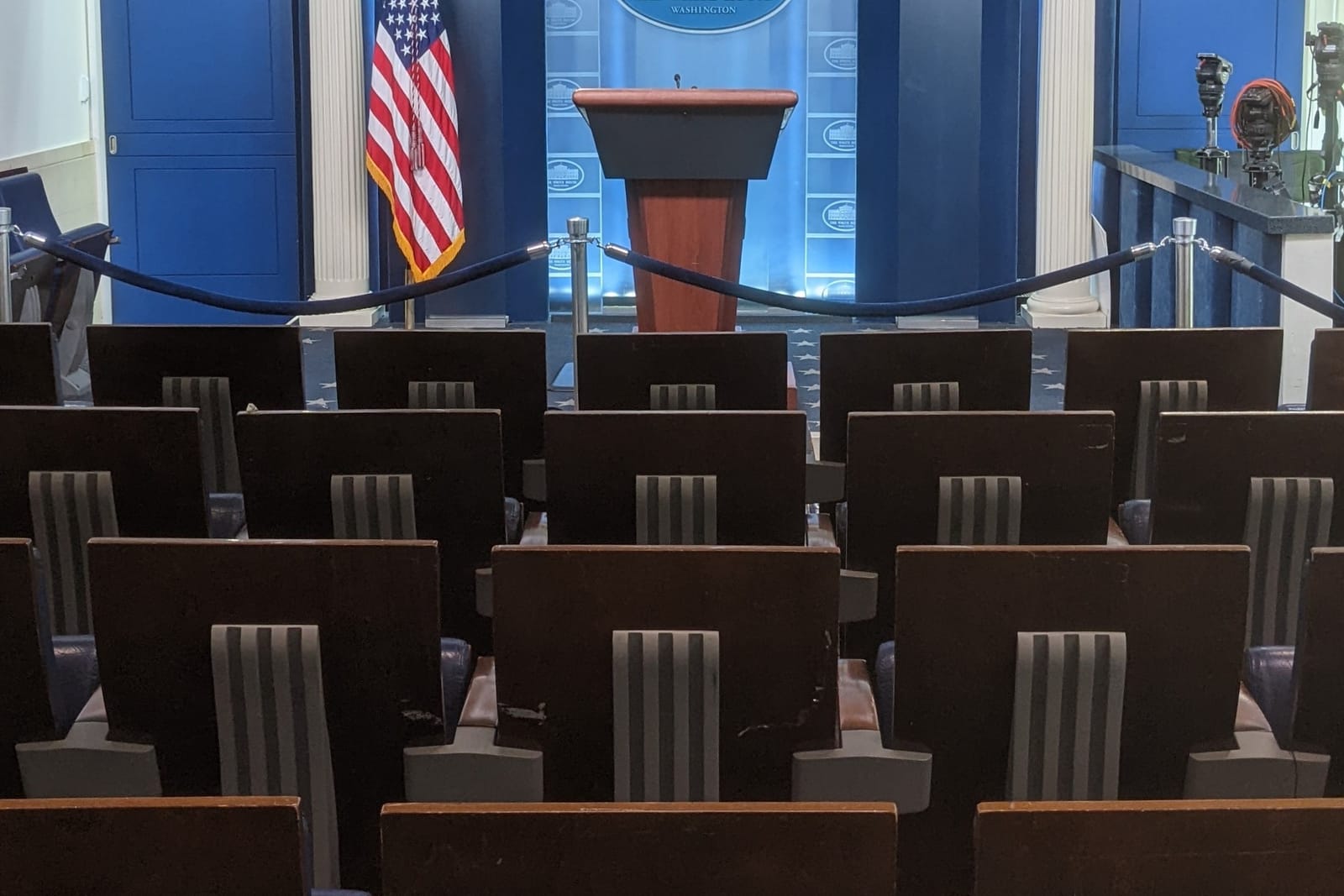 The empty James S. Brady Press Briefing Room in the West Wing, seats and podium, taken September 2022.